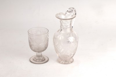 Lot 244 - A Victorian engraved glass ewer and similar...