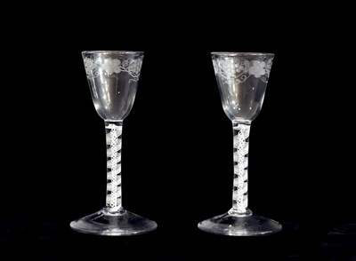 Lot 245 - A pair of 18th Century engraved air twist wine...