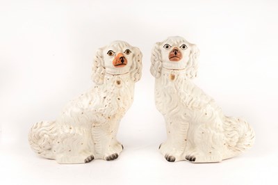 Lot 272 - A pair of white glazed Staffordshire dogs,...