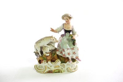 Lot 318 - A Meissen group of a girl and sheep, incised...