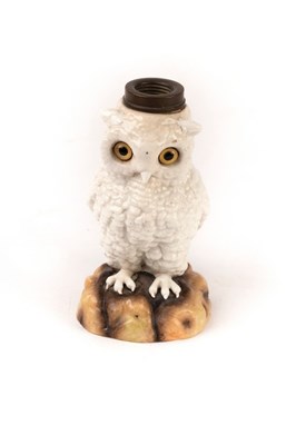 Lot 350 - A German ceramic owl lamp base with glass eyes,...