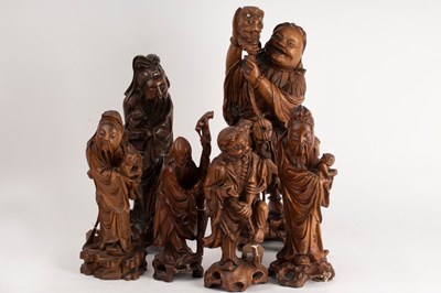 Lot 408 - Six Chinese carved root wood figures of...