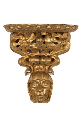 Lot 445 - A Florentine gilt wall bracket, the shelf...