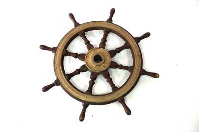 Lot 470 - A brass mounted ship's wheel, 82cm wide across...