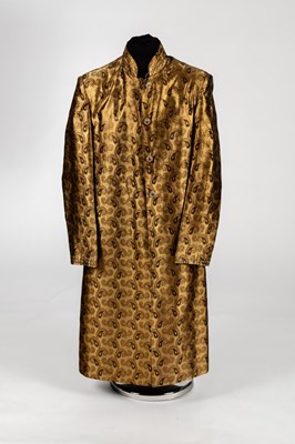 Lot 484 - A button-through coat in a bronze paisley...