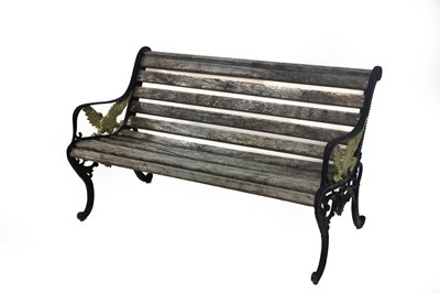 Lot 505 - A slatted garden bench, the iron end supports...