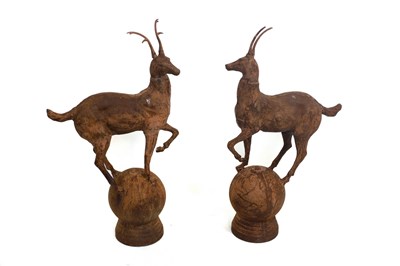 Lot 506 - A pair of iron gate pier finials cast as deer,...