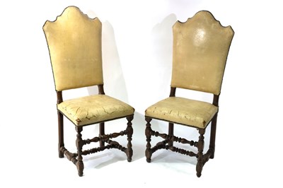 Lot 539 - A pair of arch back chairs with leather...