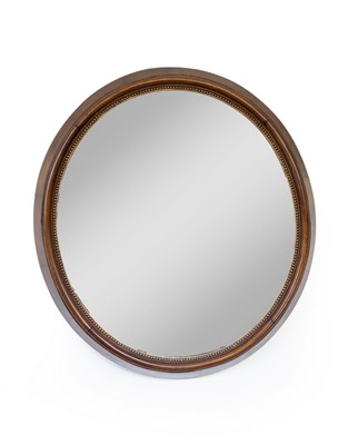 Lot 545 - A Victorian walnut framed mirror, the oval...