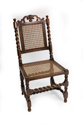 Lot 551 - A 17th Century walnut cane back side chair...