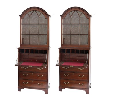 Lot 560 - A pair of George III mahogany secretaire...