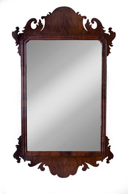 Lot 567 - A large George II walnut fret framed mirror,...