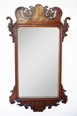 Lot 568 - A George III mahogany mirror with a pierced...