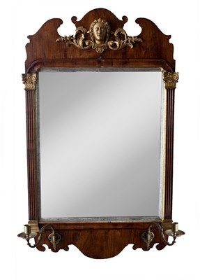 Lot 576 - A George II walnut and parcel gilt wall mirror,...