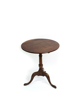 Lot 581 - A George III oak tripod table with circular...