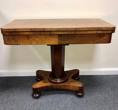 Lot 586 - A Victorian rosewood fold-over card table on...