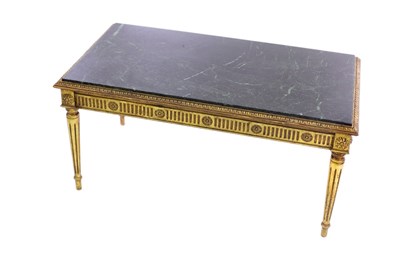 Lot 595 - A marble top coffee table on fluted gilt legs,...