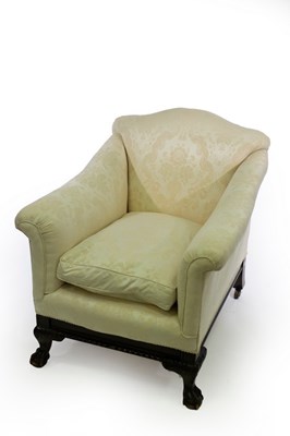 Lot 596 - A deep-seated armchair on ball and claw front...