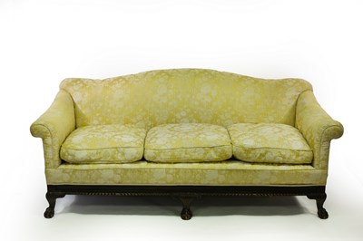 Lot 597 - A deep-seated three-seater sofa on ball and...