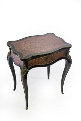 Lot 604 - A 19th Century Boulle table, the hinged top...