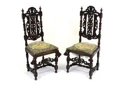 Lot 606 - A pair of oak chairs (one cane seat defective)