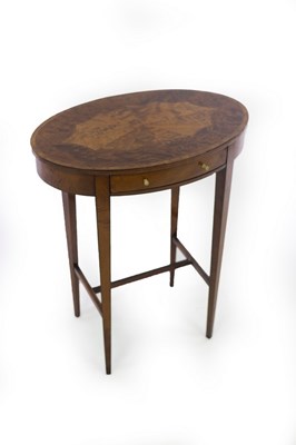 Lot 609 - An oval satinwood and yew wood side table,...