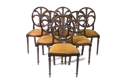 Lot 621 - A set of six dining chairs, each with...