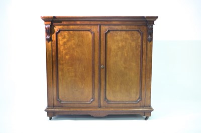 Lot 625 - A 19th Century walnut cabinet, the panel doors...