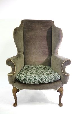 Lot 648 - An 18th Century style wingback armchair