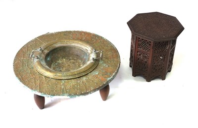 Lot 655 - A Moroccan low brass table with lift out bowl...