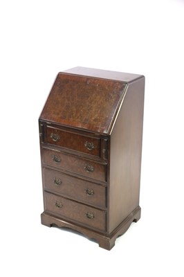 Lot 688 - An early 20th Century narrow walnut bureau,...