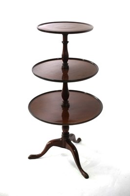 Lot 700 - A George III mahogany three-tier dumb waiter...