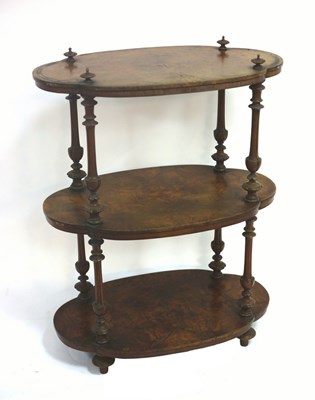 Lot 706 - A Victorian walnut whatnot, the three shaped...