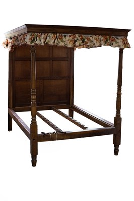 Lot 707 - An oak tester bed with panelled headboard and...