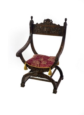 Lot 719 - An Italian carved walnut X-framed armchair