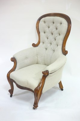 Lot 734 - A Victorian button back armchair with carved...