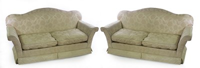 Lot 745 - A pair of two-seater sofas upholstered in...