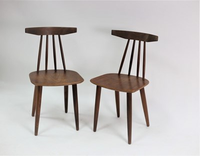 Lot 749 - A pair of Danish teak stick back chairs by...