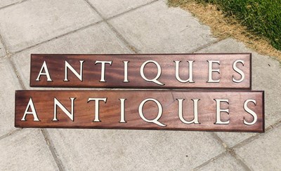 Lot 752 - A pair of signs for 'Antiques' with enamel...