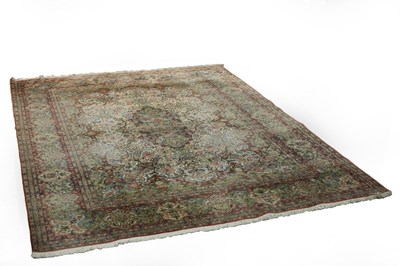 Lot 770 - A Kashmiri silk rug, the foliate scrolling...