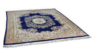 Lot 772 - A Chinese carpet, the central floral medallion...