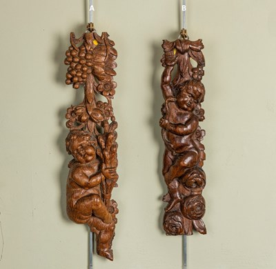 Lot 793 - A pair of 17th Century carved oak putti (losses)