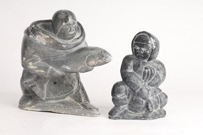 Lot 799 - An Inuit carving of a fisherman, 25cm high and...