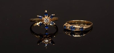 Lot 11 - A sapphire and diamond star-shaped ring, the...