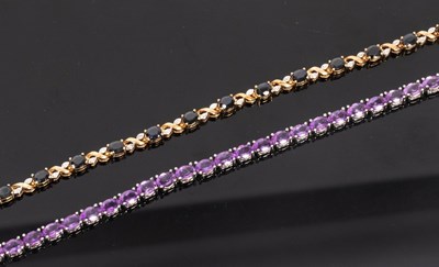 Lot 42 - A diamond and sapphire bracelet set in 9ct...
