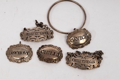 Lot 82 - Three George III silver spice bottle labels,...