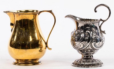 Lot 109 - A silver gilt milk jug, Edward Barnard & Sons...