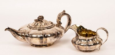 Lot 117 - A George IV silver teapot and cream jug,...