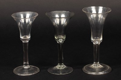 Lot 305 - Two 18th Century wine glasses with trumpet...