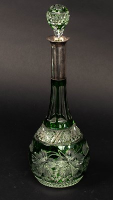 Lot 325 - A green flash cut glass decanter with a German...